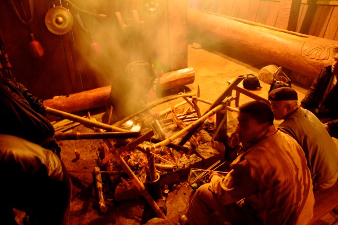 Pork is being smoked in charcoal